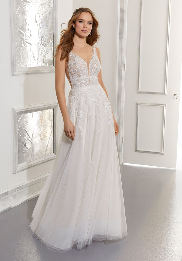 Model wears the Angela wedding gown by Morilee