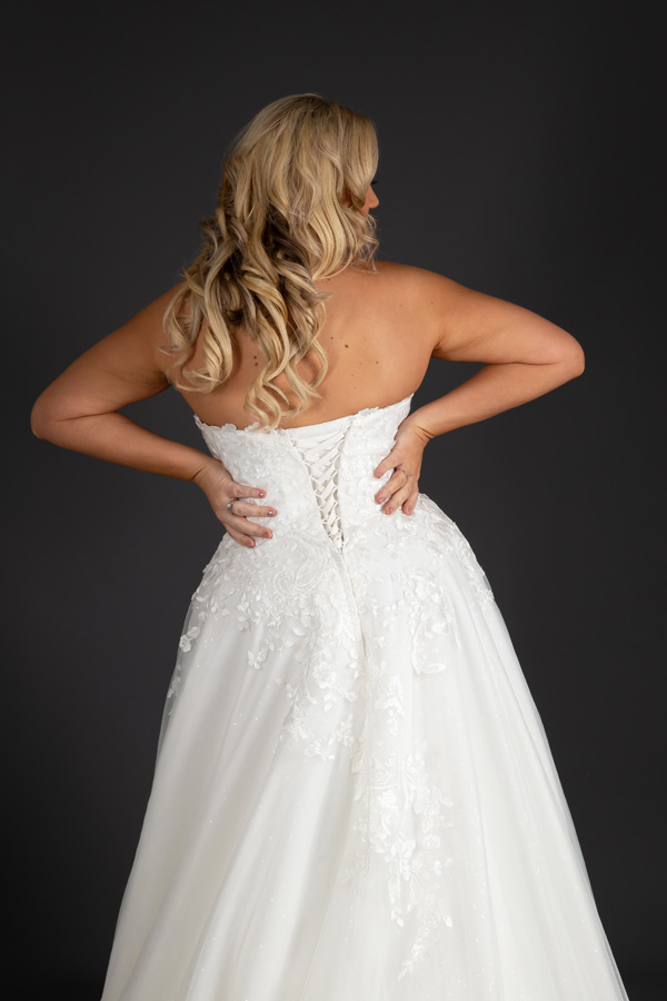 Shot of the back of a model wearing Alice Bridal Dress stocked by Roberta's Bridal, Burslem