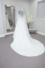 Wedding dress and veil in front of a mirror in the Bridal Dressing room at Roberta's Bridal in Burslem, Stoke-on-Trent