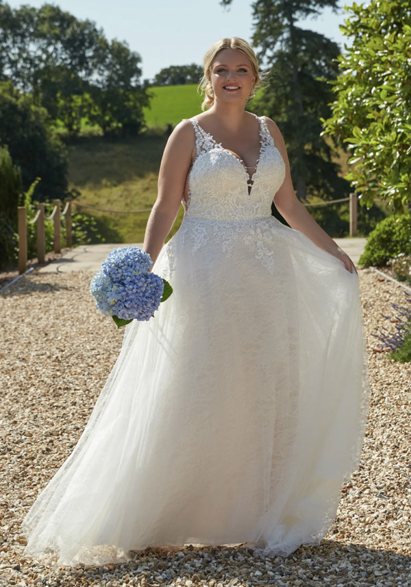 Model wears the Indianna wedding gown by Romantica of Devon