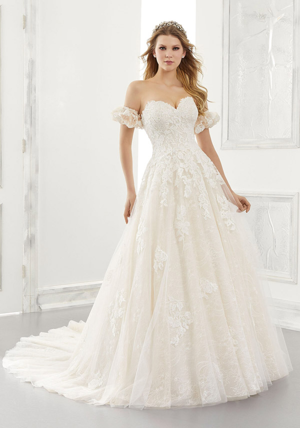 Model wears the Abigail wedding gown by Morilee