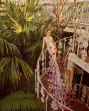 Model wears a dress from the Ronald Joyce Botanical Collection