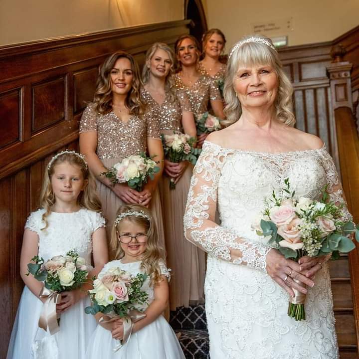 Christine in her Morilee wedding dress with her bridesmaids