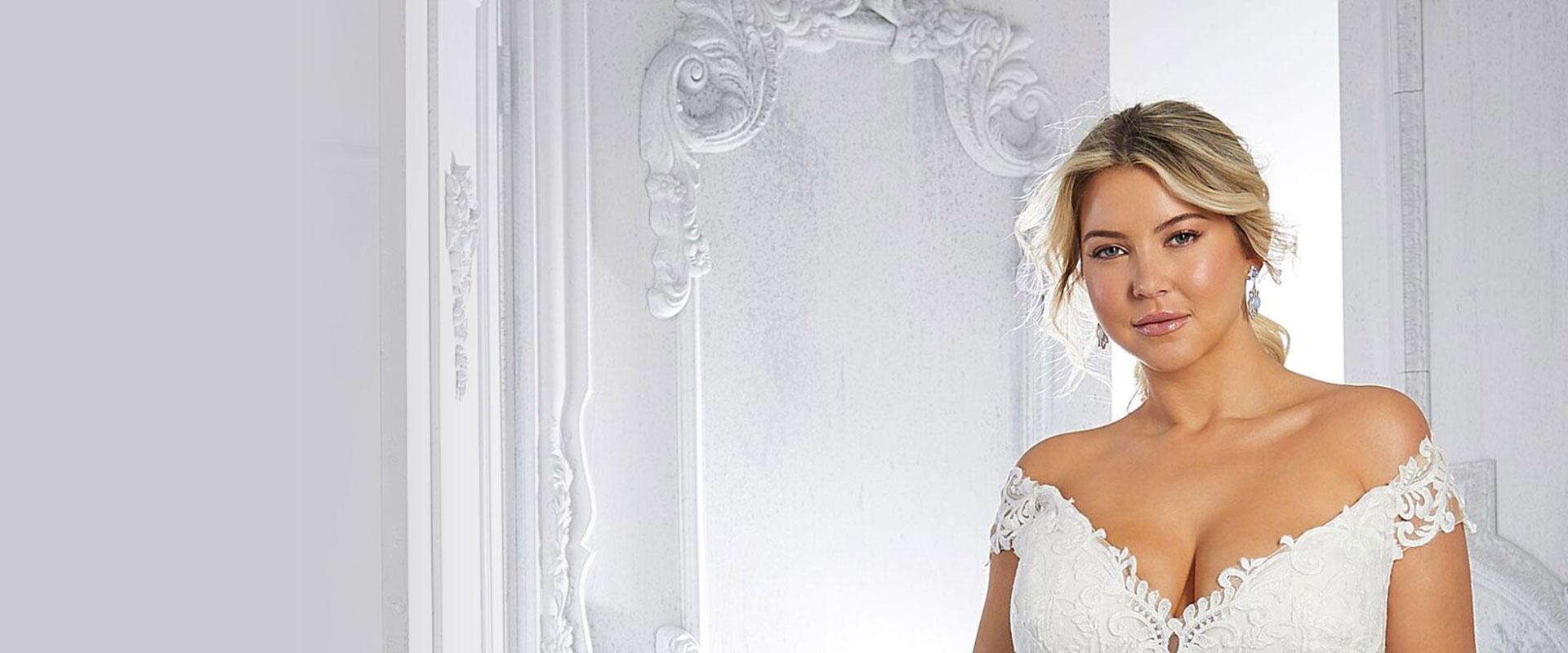 Model wearing a plus size wedding dress at Robertas Bridal in Stoke-on-Trent