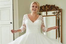 Model wearing a plus size wedding dress at Robertas Bridal in Stoke-on-Trent