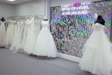 Wedding dresses on display in front of a mirrored wall at Roberta's Bridal in Burslem, Stoke-on-Trent