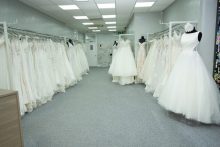 Designer wedding dress hanging on two rails at Robertas Bridal in Stoke-on-Trent